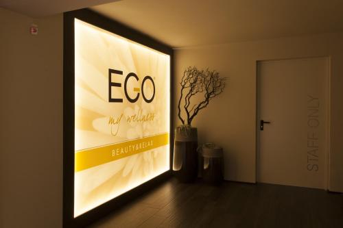 a large sign on a wall in a room at Ego Hotel in Ancona
