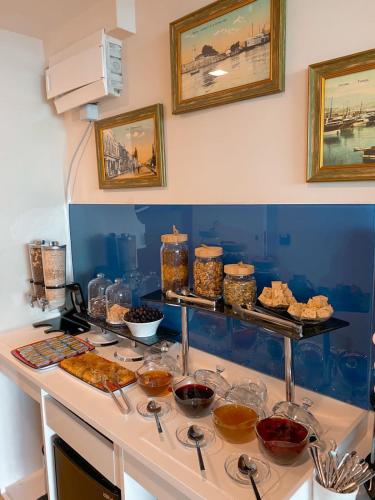 a kitchen with a counter with some food on it at Come a Lot Aparthotel Batumi in Batumi