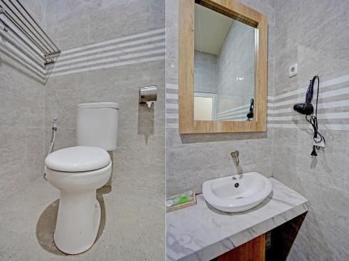 La salle de bains est pourvue de toilettes et d'un lavabo. dans l'établissement OYO 91997 Edhotel Smk Models Syariah, à Pasanggaran