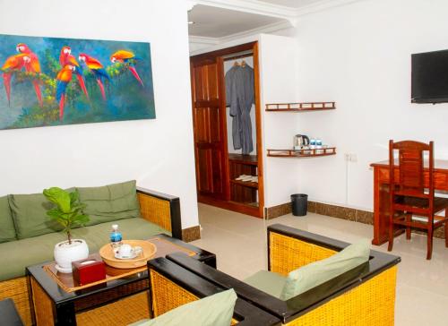 a living room with a couch and a table at The Blanc Residence in Siem Reap