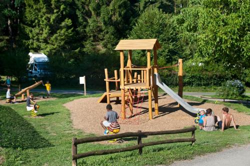 a group of children playing in a playground at Les gites de Sarlat in Sarlat-la-Canéda