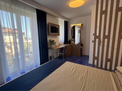 Ένα ή περισσότερα κρεβάτια σε δωμάτιο στο Luxury in the heart of Tropea- Residenza AquaLaguna