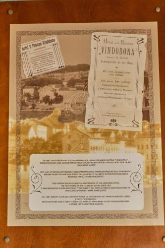 a piece of paper on top of a wooden table at Mare Mare Suites in Mali Lošinj