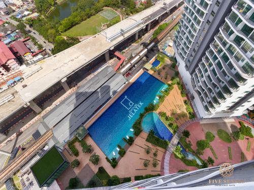 an overhead view of a building with a blue pool at Datum Jelatek Sky Residence KLCC, Five Senses in Kuala Lumpur