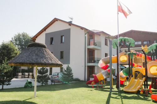 a playground in the yard of a house at Villa Monica Apartamenty in Szczyrk
