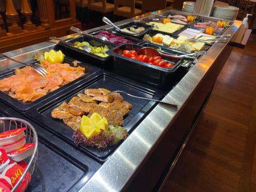 a buffet line with many different types of food at Park Hotel Vossevangen in Vossevangen