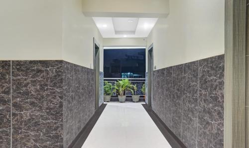 a hallway of a house with stone walls at Itsy Hotels Cradle Regency in Rānchī