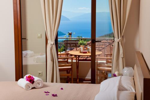 a hotel room with a view of a balcony at Calm View in Vasiliki