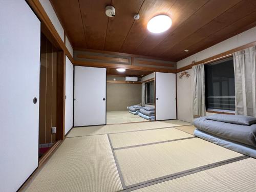 Ένα ή περισσότερα κρεβάτια σε δωμάτιο στο HOSTEL OE
