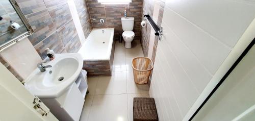 a small bathroom with a sink and a toilet at Mermel 4 - Sleeps 6 - Overlooking Margate Lagoon! in Margate