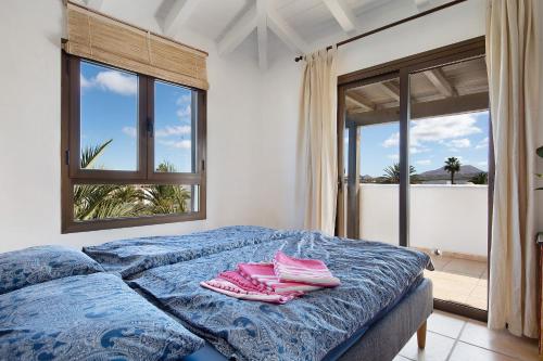 Säng eller sängar i ett rum på Lajares Villa The Green Room