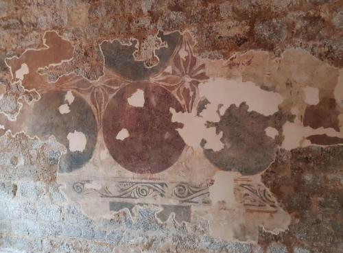 a wall with a painting of a chicken on it at Luxury Tower House in heart of Pisa in Pisa