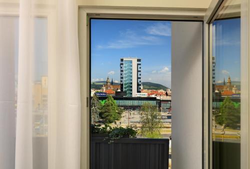 a view of a city from a window at Congress Hotel Centrum in Košice
