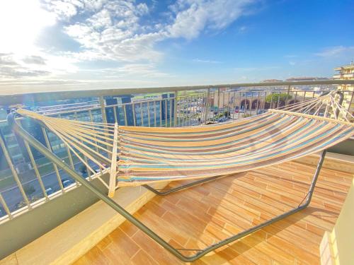 a hammock on the deck of a ship at Casa Relax con Terrazza Panoramica in Fiumicino