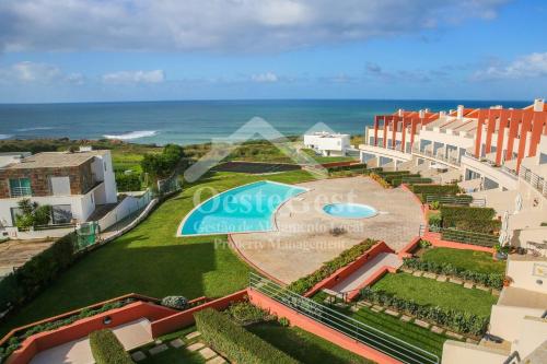 an aerial view of a resort with a swimming pool and the ocean at The Lookout in Areia Branca