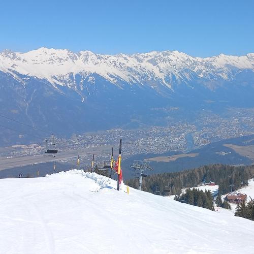 a person standing on top of a snow covered mountain at Ferienwohnung Götzner Auszeit in Innsbruck