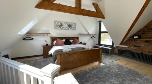 a bedroom with a large bed in a attic at Chapel Row 2 in Wirksworth