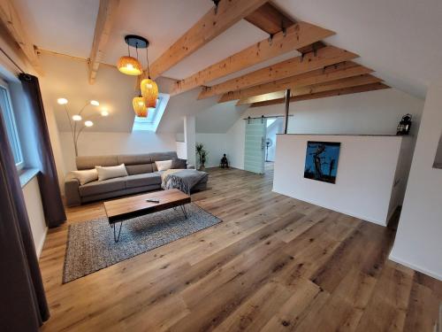 a living room with a couch and a table at Ferienwohnungen Villa Ventil in Feldberg