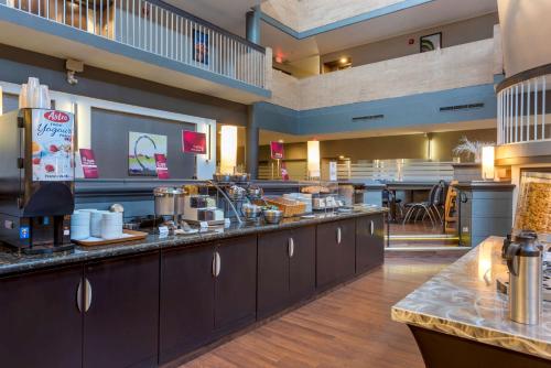 a fast food restaurant with a large counter top at Best Western Plus Village Park Inn in Calgary