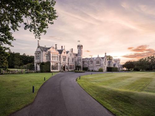 an estate with a driveway leading to a mansion at SCHLOSS Roxburghe, part of Destination by Hyatt in Kelso
