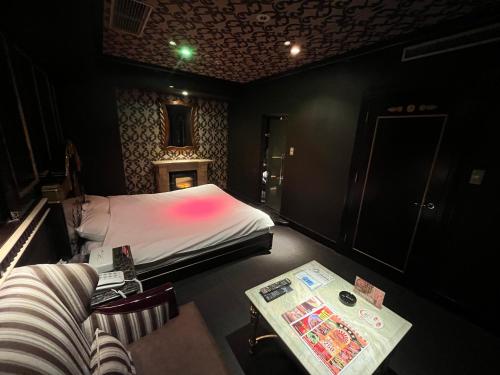 Кровать или кровати в номере Hotel Pharaoh-Adult Only