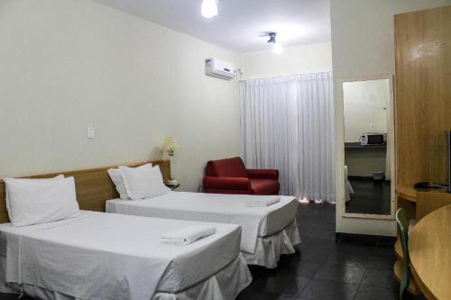 Katil atau katil-katil dalam bilik di Bravo Suites São Carlos