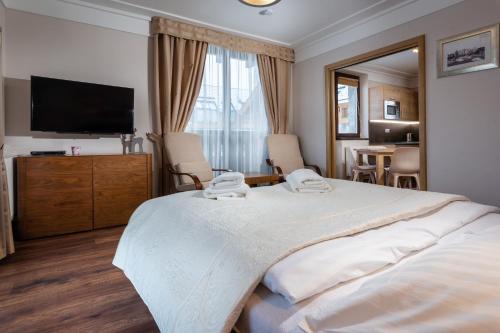 Ένα ή περισσότερα κρεβάτια σε δωμάτιο στο TATRYSTAY Apartment Javor Tatranská Lomnica