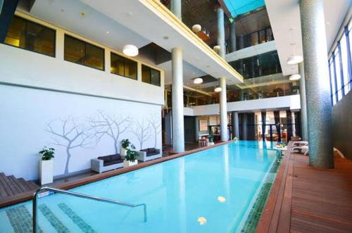 a large swimming pool in a large building at URBAN PARK UMHLANGA J001 in Durban