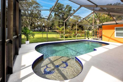 a swimming pool in the middle of a house at 13 Beach Cottage With Heated Pool In Clearwater in Clearwater