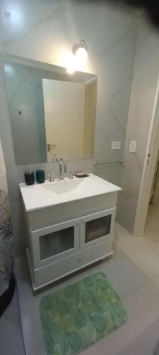 a bathroom with a sink and a mirror at Colon Suites 1. Duplex a 18 minutos aeropuerto Ezeiza in Monte Grande