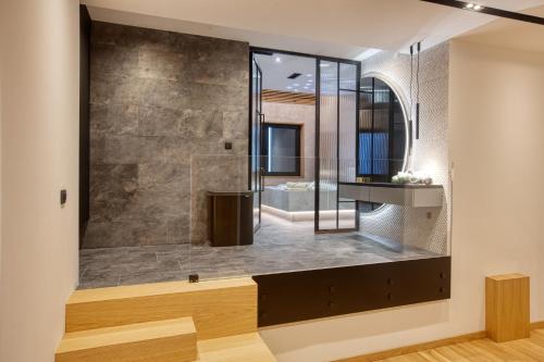 a bathroom with a shower and a sink at Galeria Jahorina Luxury Ski Apartments and Restaurant in Jahorina