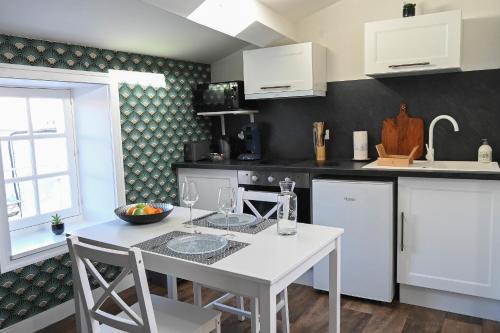 Kuchyň nebo kuchyňský kout v ubytování L'orchidée #Hyper-centre #Marché couvert