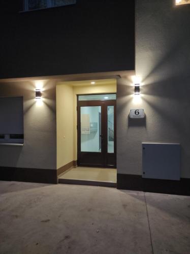 a hallway with two lights on the side of a building at Marinkovic stan na dan in Vranje