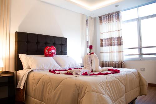 Łóżko lub łóżka w pokoju w obiekcie HOTEL KILLASUMAQ