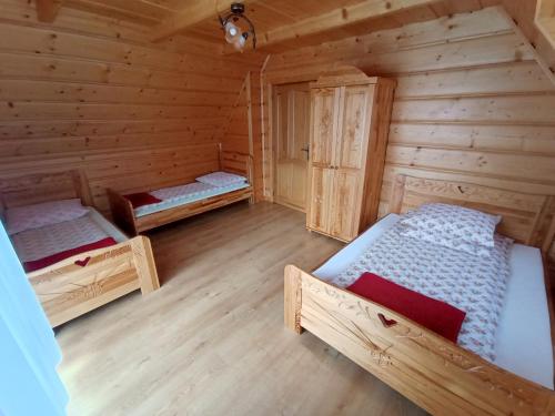 Кровать или кровати в номере Domki u Jasia