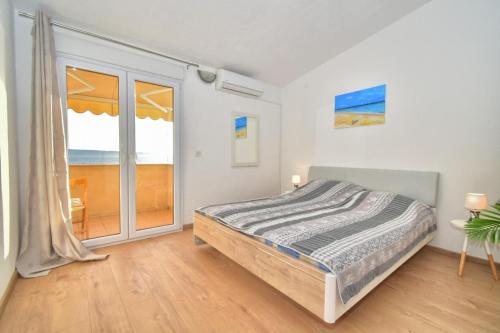 Postel nebo postele na pokoji v ubytování Apartments Bartulić