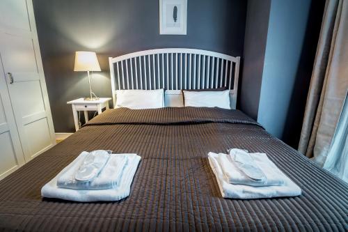 a bedroom with a bed with towels on it at Luxury Hotel Room 735 at Orbi Palace in Bakuriani in Bakuriani
