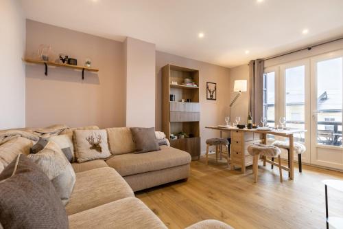 a living room with a couch and a table at Orpin in Font Romeu Odeillo Via