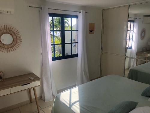 Postel nebo postele na pokoji v ubytování Apt 2 chambres Vue Lagon