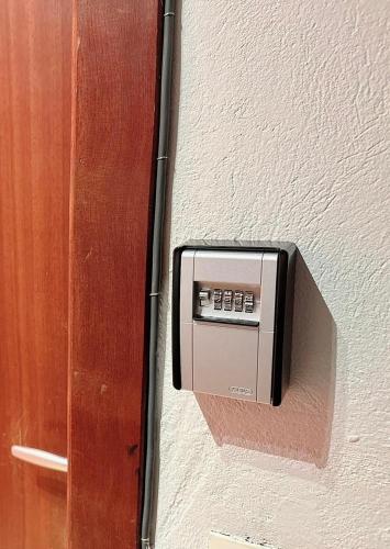 a control panel on the side of a wall at Appartement centre ville in Tournai
