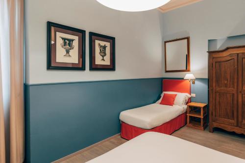 Postel nebo postele na pokoji v ubytování Hotel San Luca