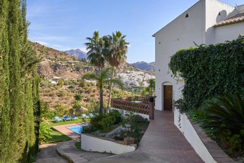 a house with a view of the mountains at Group Villa 14 Pool wifi Air in Frigiliana