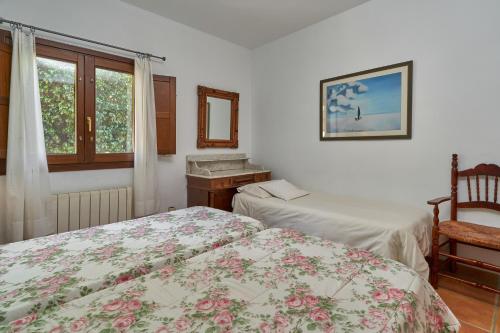 a bedroom with two beds and a window at Group Villa 14 Pool wifi Air in Frigiliana