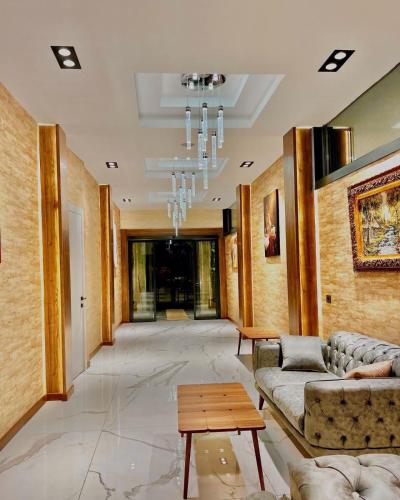 a lobby with couches and a table in a building at Özkaya hotel in Sivas