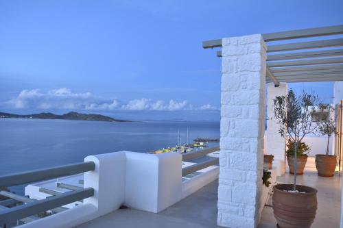 a balcony with a view of the water at Hotel Senia - Onar Hotels Collection in Naousa