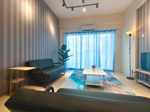 a living room with a couch and a table at Pavilionvillie M1T584 by irainbow in Simpang Pulai