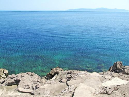 a view of the ocean from the top of a mountain at Apartment Nika in Lovran