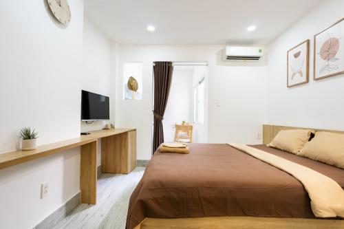 Giường trong phòng chung tại Ekomo Home - Central Saigon