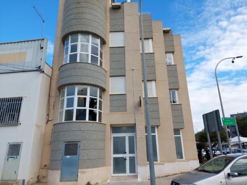a tall brick building with at Hostal GARDEN ROUS in Paiporta