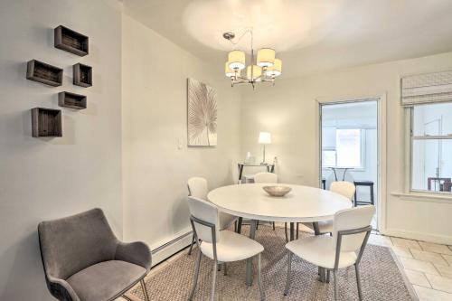 a dining room with a white table and chairs at Hartford Vacation Rental - Close to Downtown! in Hartford